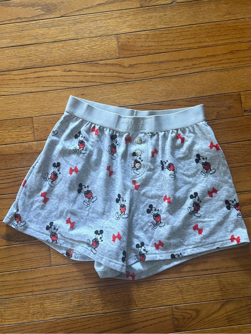 American Eagle Outfitters Gray Mickey Mouse Print Shorts with Red Bow Accents